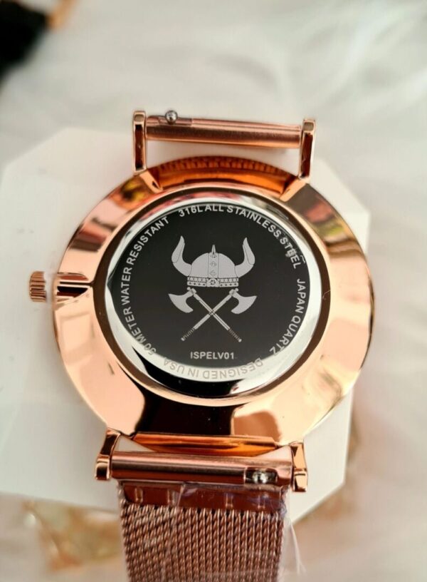 A watch with an image of a viking helmet and axes on the face.