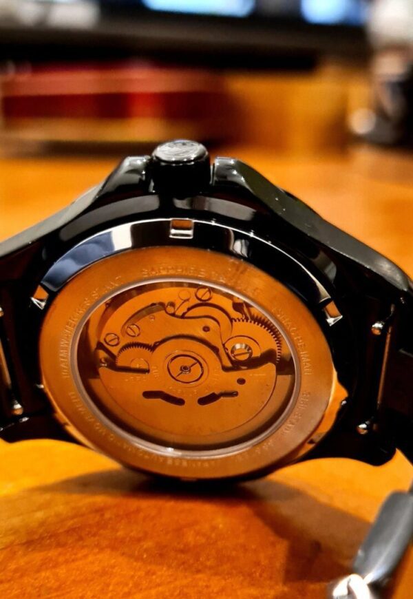 A watch is shown with the back of it.
