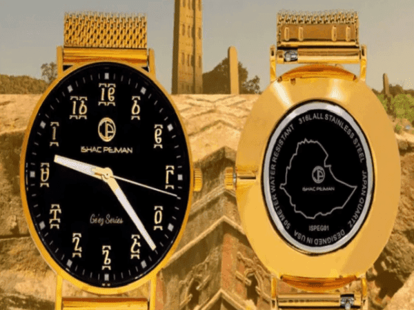 A gold watch with the face of an african continent.