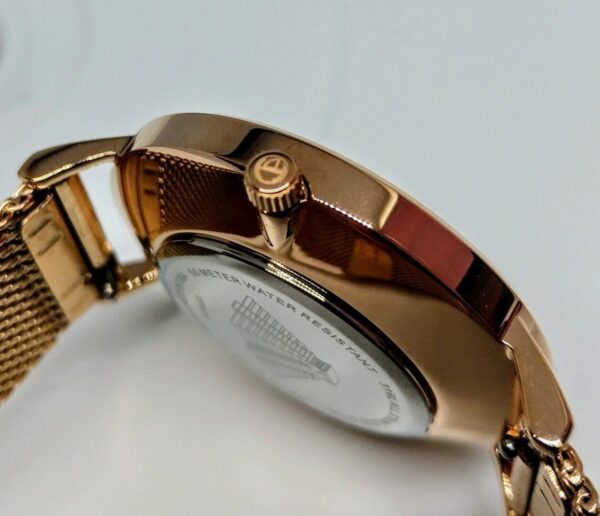 A close up of the back side of a watch