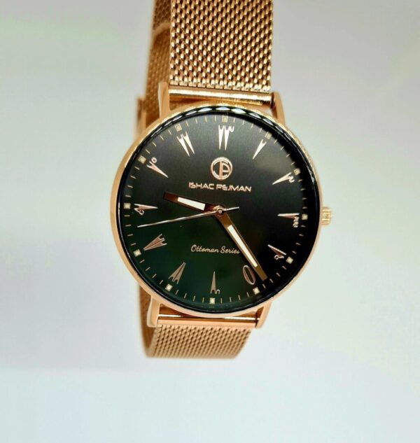 A gold watch with black face and mesh band.