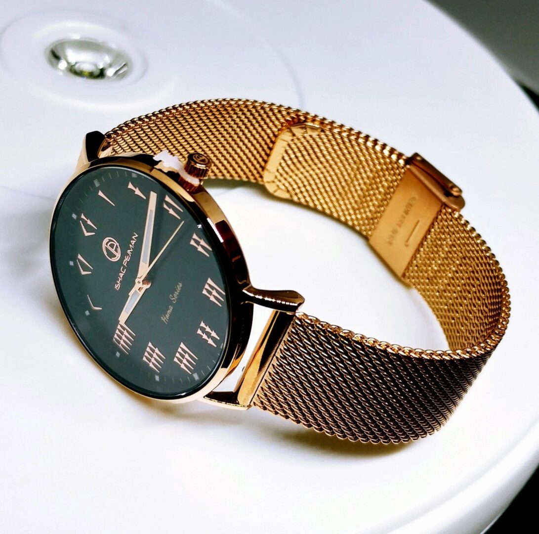 A watch is shown on top of the table.