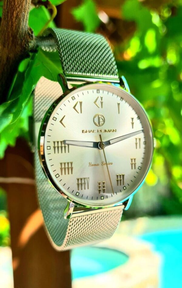 A silver watch sitting on top of a metal chain.