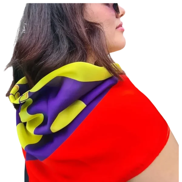 A woman wearing glasses and a red, yellow and purple scarf.