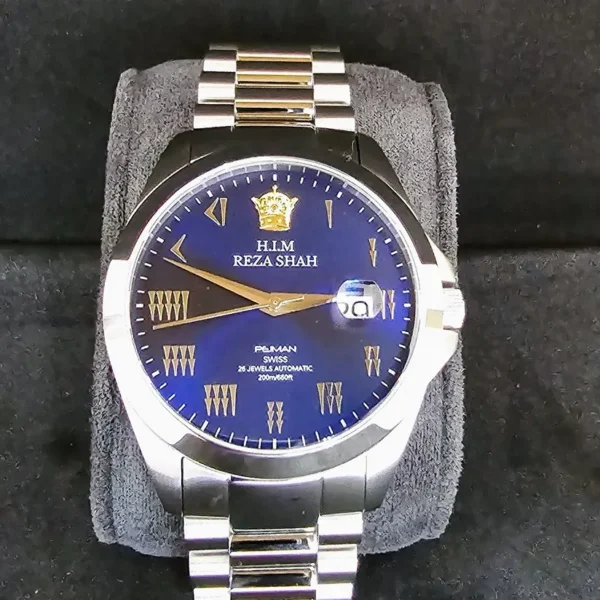 A watch is shown with the crown on it.