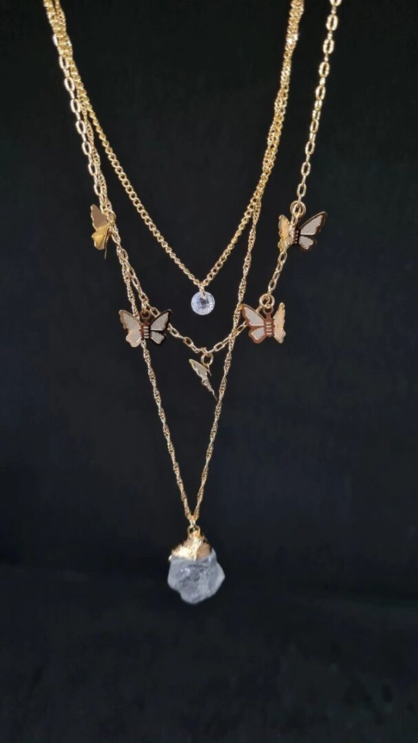 A necklace with multiple chains and charms.