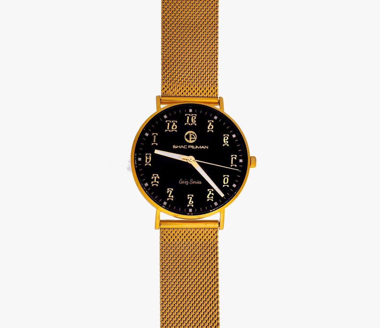 A gold watch with black face and mesh band.