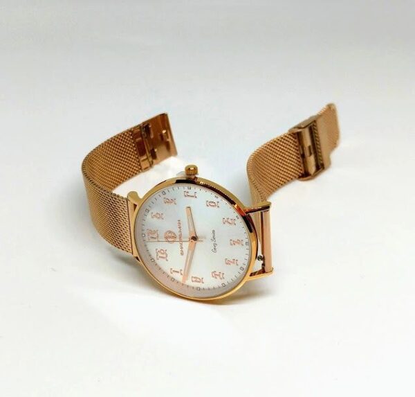 A gold watch with white face and mesh band.