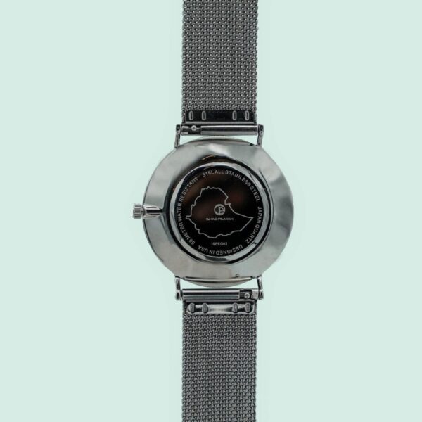 A silver watch with a black face and a metal strap.