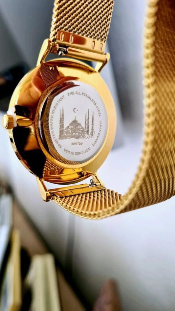A gold watch with a chain around it