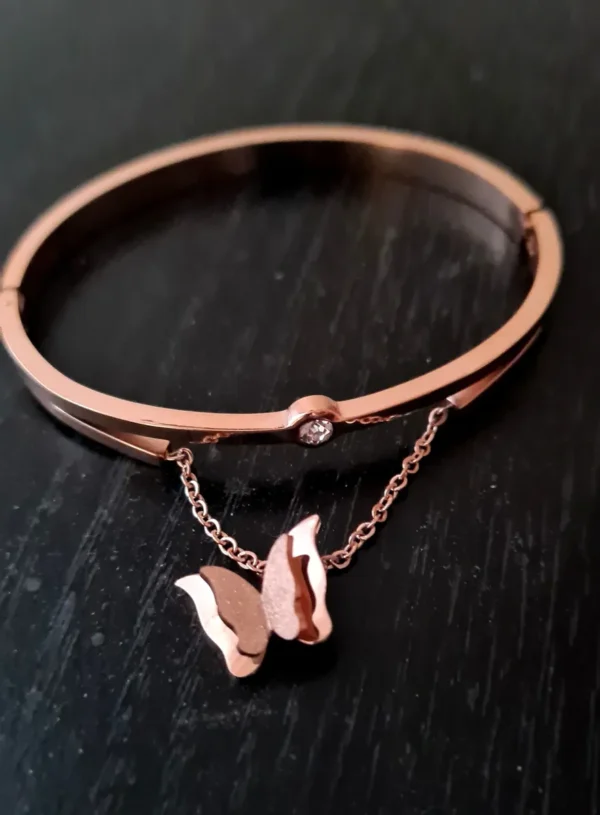 A bracelet with a butterfly charm attached to it.
