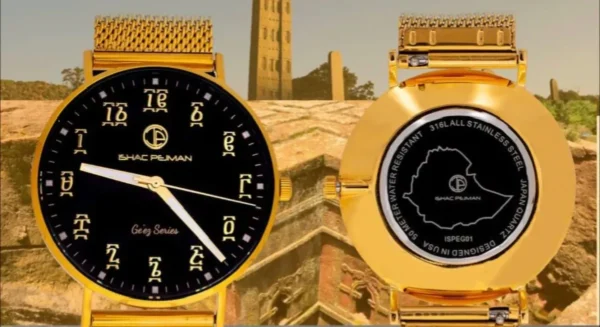 Two gold watches with arabic numerals on the face.