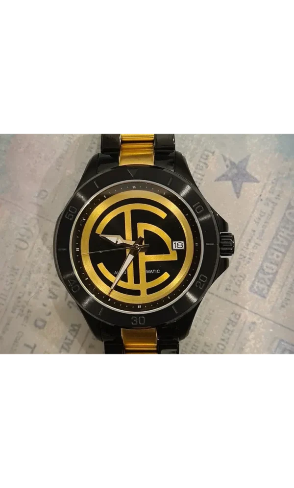 A watch with the letters f and g on it.